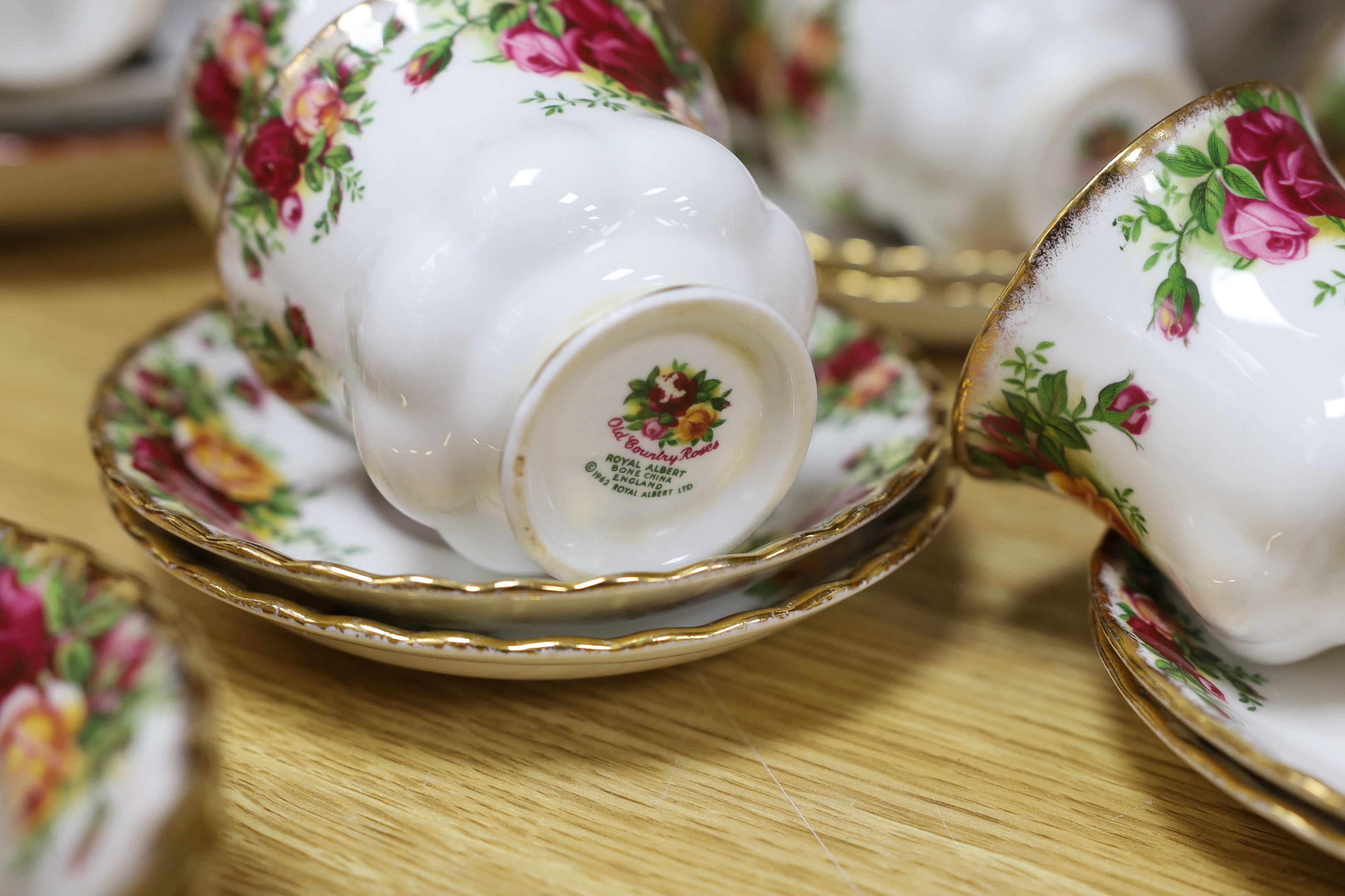 A Royal Albert Old Country Rose dinner service and tea service including trios, tureens and oval dishes